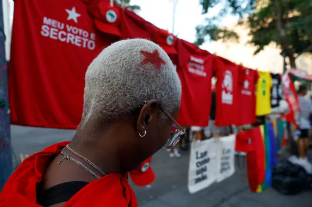 A supporter of candidate Luiz Inácio Lula da Silva of Workers' Party (PT) shows her hairstyle on presidential runoff day on October 30, 2022 in Rio de Janeiro, Brazil