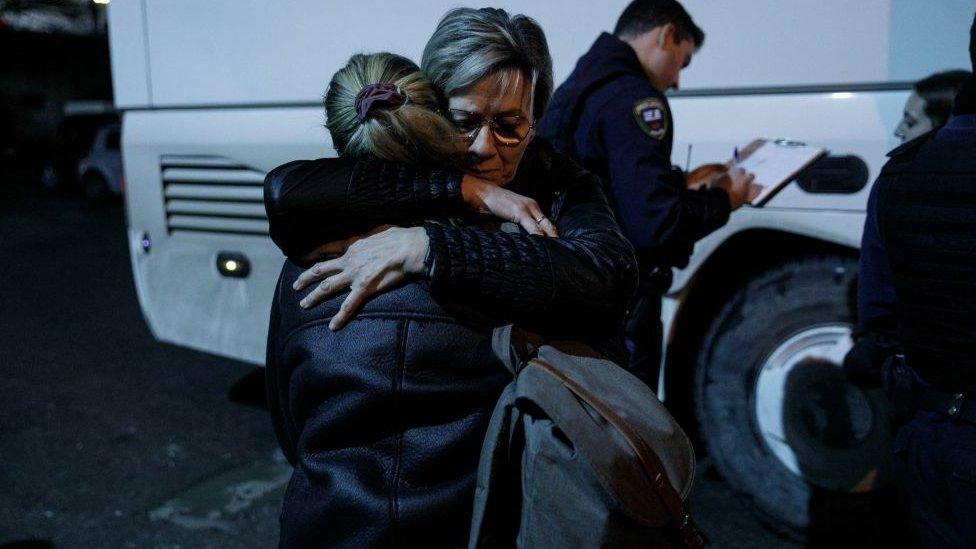 Two women embrace at the Thessaloniki railway station