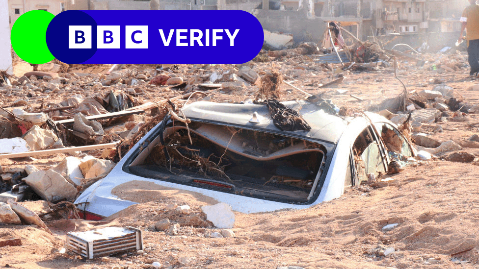 Car engulfed in mud and rubble