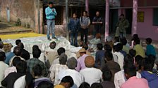 Villagers in Arniya Daoud, India listen to a community-led Total Sanitation Facilitator