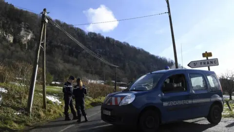 AFP French Gendarmes block the access to Saint-Franc, in the Eastern French region of Savoie on February 14, 2018