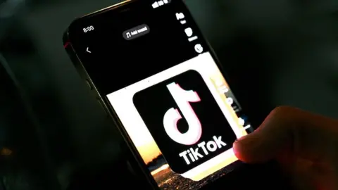 Getty Images In this photo illustration taken on April 21, 2022, the icon of an video sharing mobile phone application TikTok is pictured on a mobile phone used by an Afghan youth in Kabul.