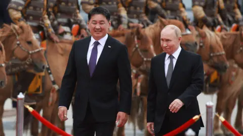 EPA Mongolian President Ukhnaagiin Khurelsukh and Vladimir Putin in Ulaanbaatar