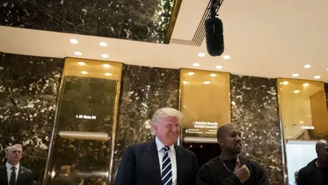 Getty Images Donald Trump and Kanye West outside the famous golden elevators of Trump Tower, New York City, in December 2016