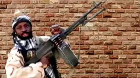 Reuters Boko Haram leader Abubakar Shekau holds a weapon in an unknown location in Nigeria