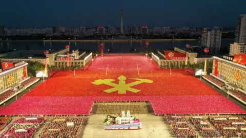 Reuters People take part in a procession to commemorate the 75th anniversary of the founding of the ruling Workers' Party