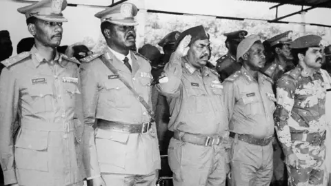 AFP President Omar al-Bashir (centre) came to power after a coup in 1989