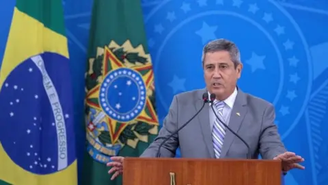 EPA Walter Souza Braga Netto, speaks after visiting the coordination center of the Covid-19 crisis committee, in Brasilia, Brazil, 25 March 2020