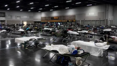 Reuters People take shelter in a cooling centre in Portland