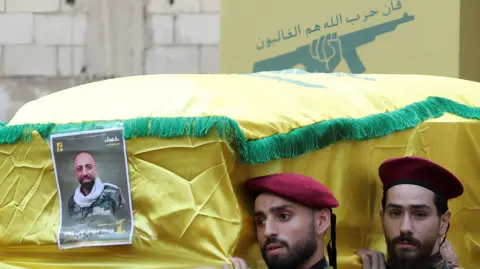 Men carry the coffin of a Hezbollah member who was killed in a pager blast (18/09/24)