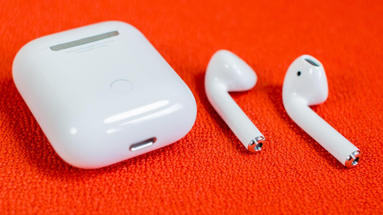 AirPods on an orange surface