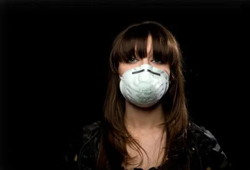 Woman wearing mask/filter to avoid catching disease.