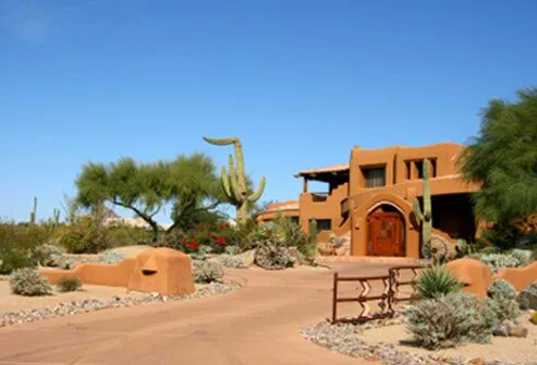 Salmon adobe style house in the Arizona desert.