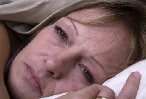 A woman suffering fatigue, a common symptom of fibromyalgia. 