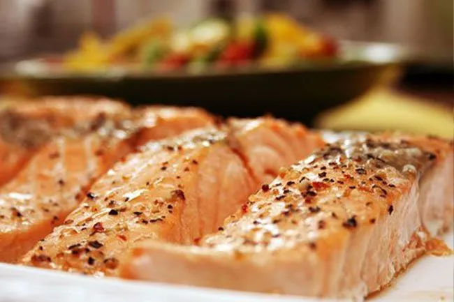 Omega-3 fatty acids in fish help reduce triglyceride levels in the blood. 