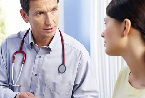 A doctor talking to a patient.