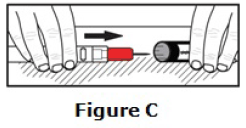 Use one hand to carefully slide the end of the auto-injector, needle first, into the labeled
carrying case cover - Illustration