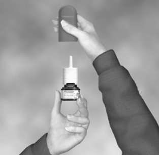 Hold the bottle as shown - Illustration