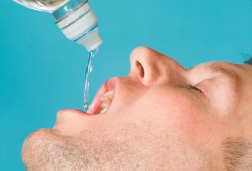 A man drinks water.