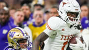 Texas Longhorns wide receiver Xavier Worthy (1) runs with the all after getting around Washington Huskies cornerback Elijah Jackson (25) in the fourth quarter of the Sugar Bowl College Football Playoff semi-finals at the Ceasars Superdome in New Orleans, Louisiana, Jan. 1, 2024. The Huskies won the game 37-31.