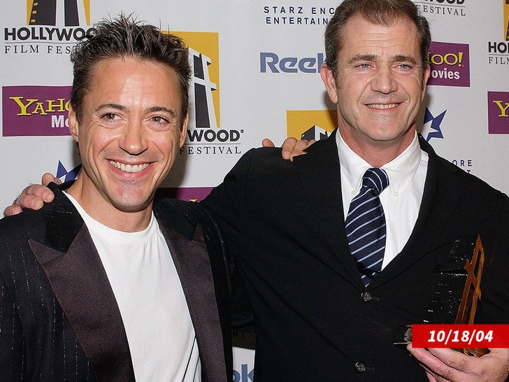 0408 Robert Downey Jr. and producer Mel Gibson getty