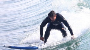 0206-james-franco-surfing-towel-change-beach-shirtless-photos-primary-2