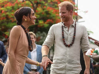 Prince Harry And Meghan Markle Holding Hands And Smiling