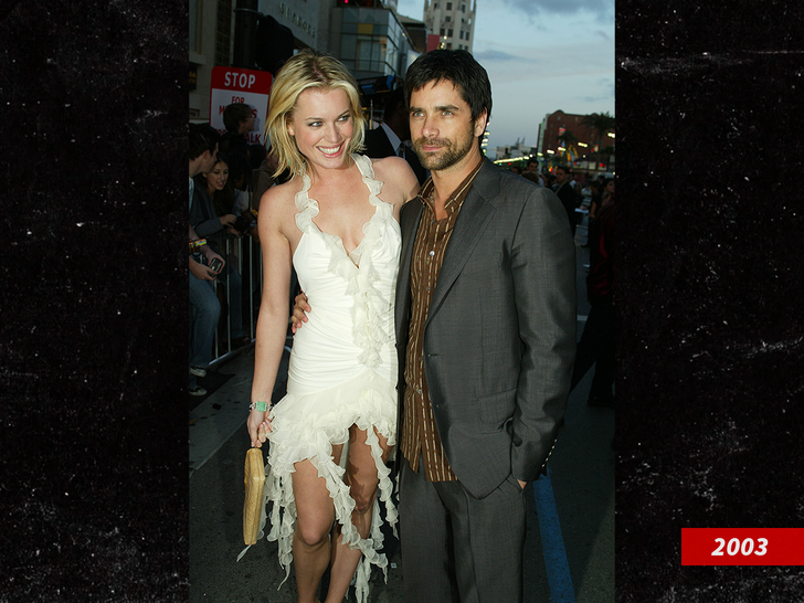 John Stamos and Rebecca Romijn