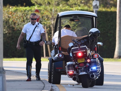 dj khaled in gold cart pulled over