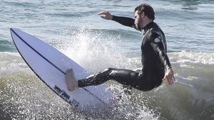 1121-Liam-Hemsworth-Surfing-Malibu-Photos-primary