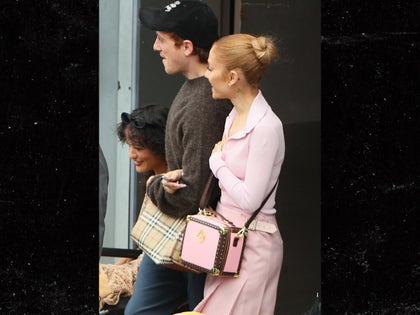 Ariana Grande arrives in Sydney arm in arm with boyfriend Ethan Slater