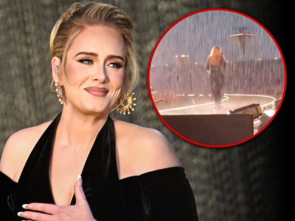 adele performing in the rain