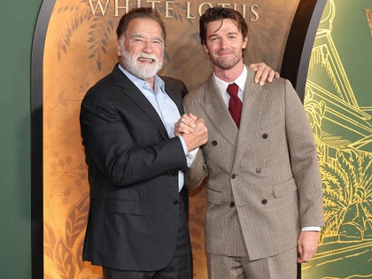 Arnold Schwarzenegger Shaking Hands With His Son Patrick On The Red Carpet For The White Lotus 3