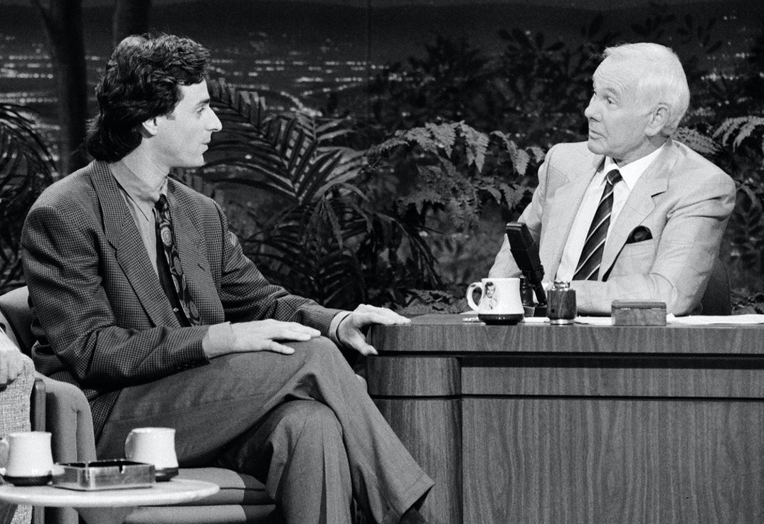 1990: Bob Saget's success continues with appearances on television talk shows including 'The Johnny Carson Show.'