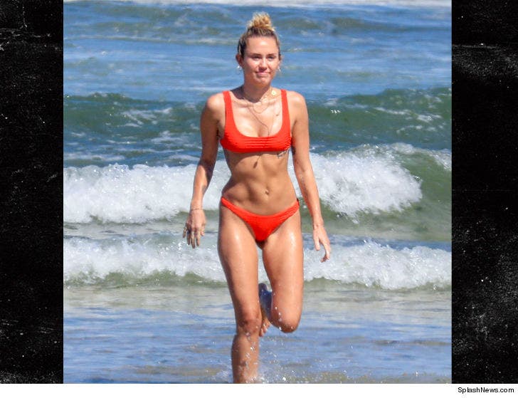 Miley Cyrus' Beach Bod Already on Point :: 0127-miley-cyrus-beach-running-splash-9