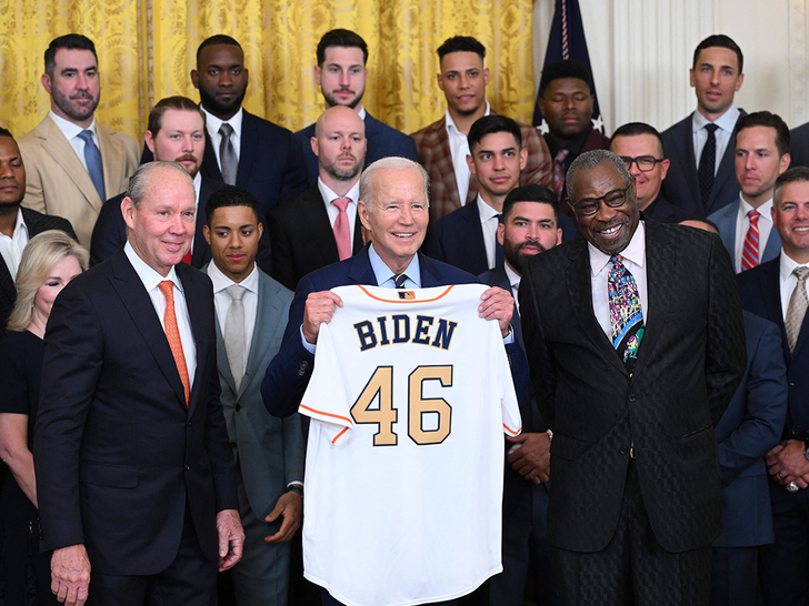 joe biden holding astros jerseys