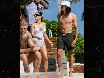 Vanessa Hudgens And Cole Tucker On A Beach