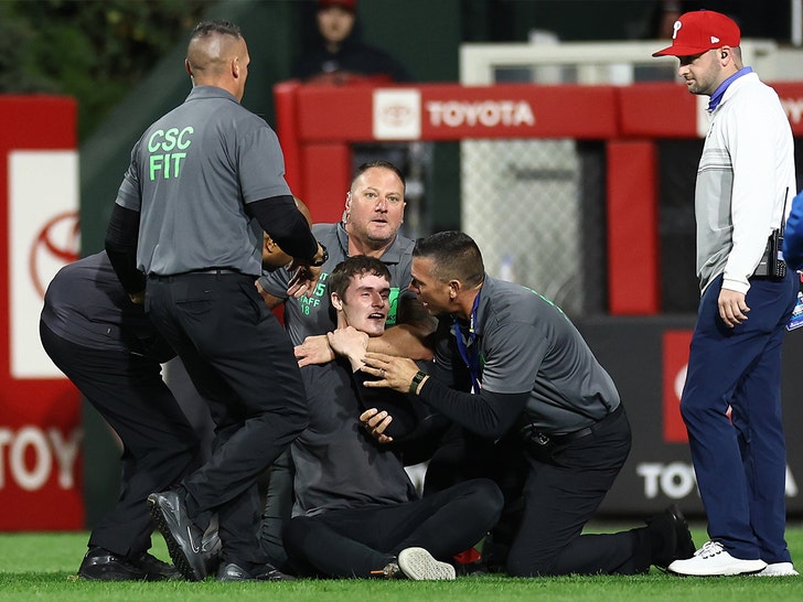 fan runs on field at phillies game getty 1