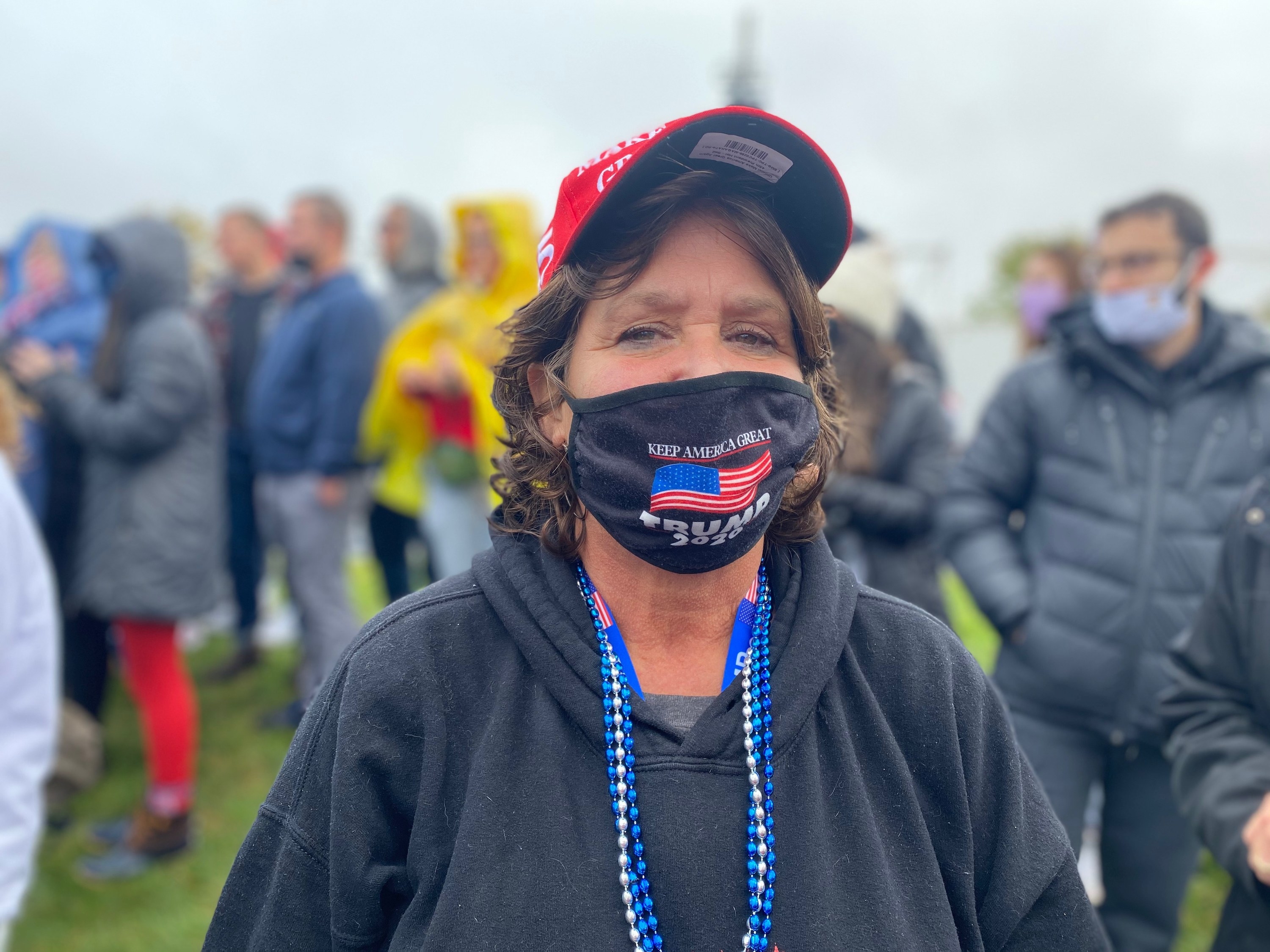 A Trump supporter wears a &quot;Keep America Great, Trump 2020&quot; mask