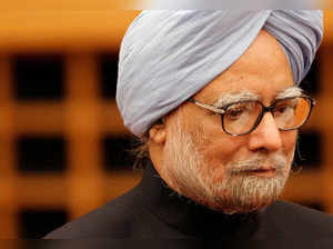 FILE PHOTO: Indian Prime Minister Manmohan Singh walks into room to deliver his speech at hotel in Tokyo