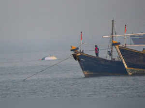 Portion of a ferry, which was recently capsized off Mumbai coast when a Navy craft crashed into it, is seen afloat at Bhaucha Dhakka, in Mumbai.