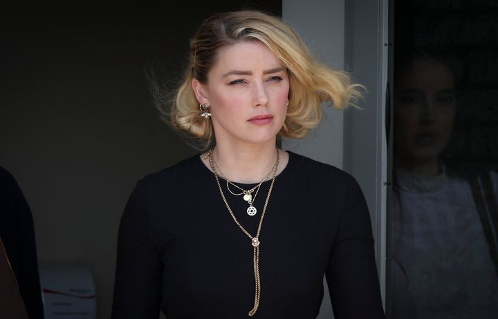 Amber Heard leaves a Virginia courthouse in June 2022, after a jury ruled that she had defamed her ex-husband Johnny Depp. The actor called Lively's accusations against Baldoni "horrifying" in a statement to NBC News.