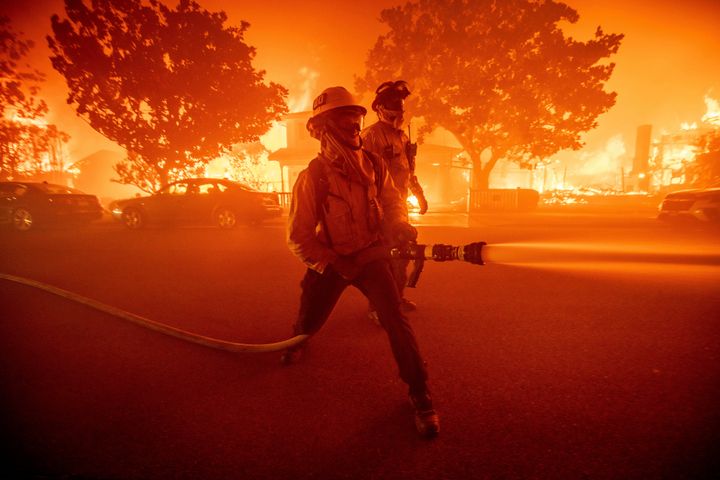 Firefighters battle the Palisades Fire as it burns multiple structures in the Pacific Palisades neighborhood of Los Angeles, on Jan. 7, 2025.