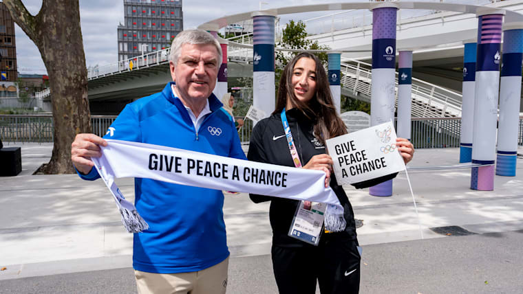 IOC President Thomas Bach with a member of the IOC Refugee Olympic Team