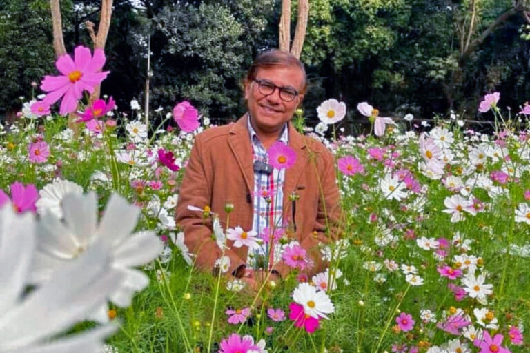 Standing amidst a vibrant field of cosmos flowers, Azharul Islam Khan highlights their numerous benefits.