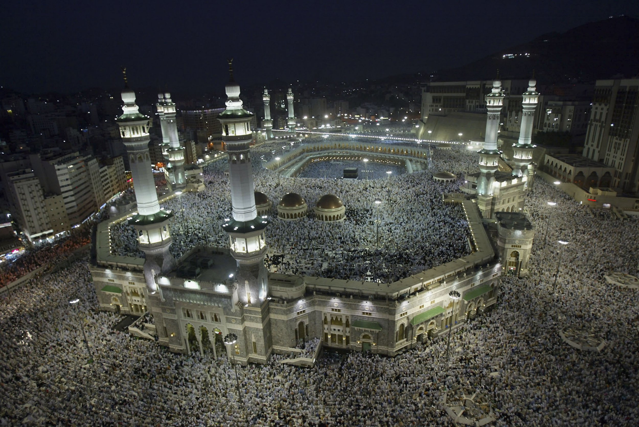 MECCA, SAUDI ARABIA - JANUARY 3: Muslim pilgrims attend the evening prayers inside the Grand Mosque and holy Kabba, the holiest places for Muslims around the world, on January 3, 2006 in the city of Mecca, Saudi Arabia. More than 1.3 million Muslim pilgrims have arrived in Mecca from all over the world to perform annual Hajj (pilgrimage) which starts on January 8, 2006. (Photo by Muhannad Fala??ah/Getty Images)