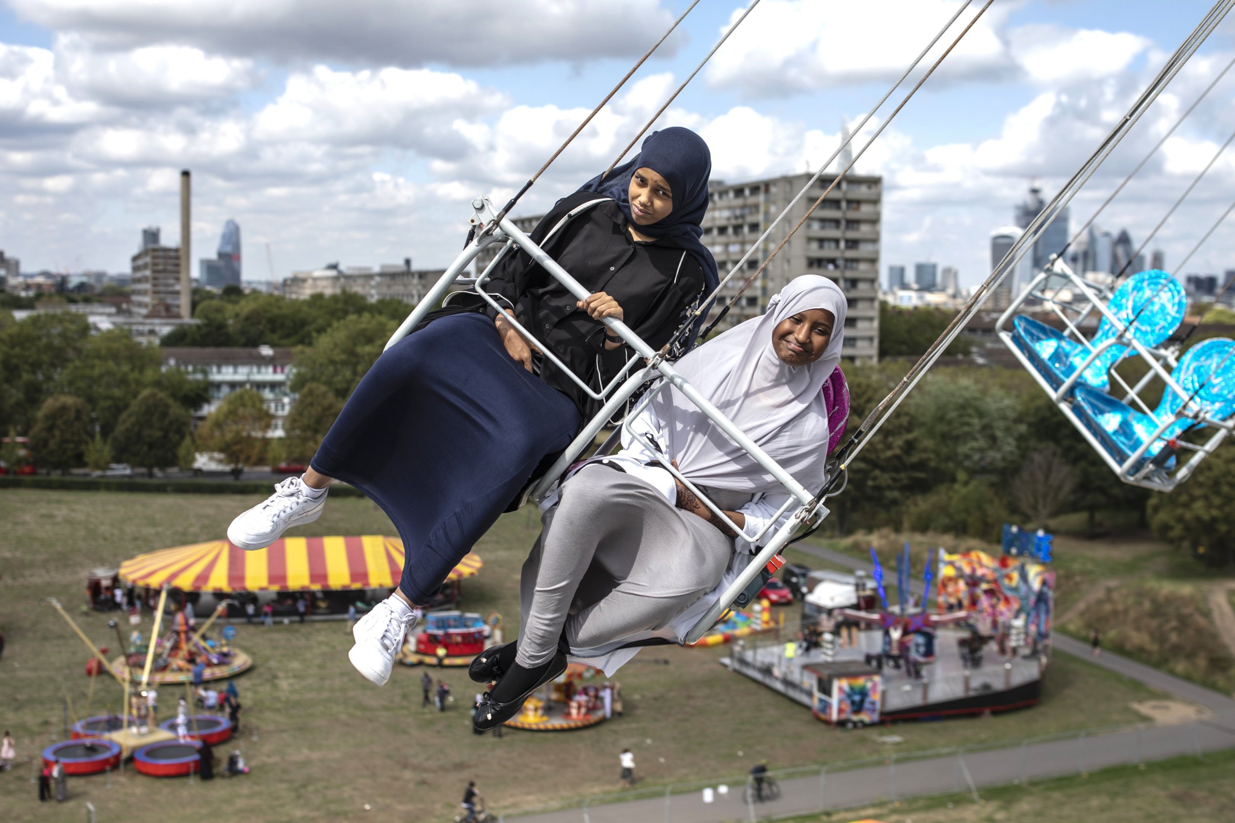 LONDON, UNITED KINGDOM - AUGUST 21: Children enjoy a ride during an Eid in the Park celebration marking the start of Eid Al-Adha at Burgess Park on August 21, 2018 in London, England. The traditional four-day celebratory festival marks one of the holiest days in the Islamic religious calendar. (Photo by Dan Kitwood/Getty Images)