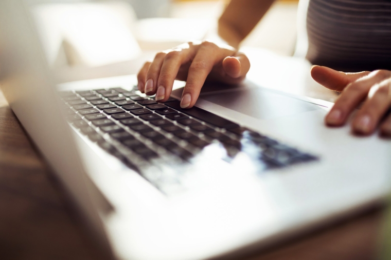 Close up of a young woman working from home