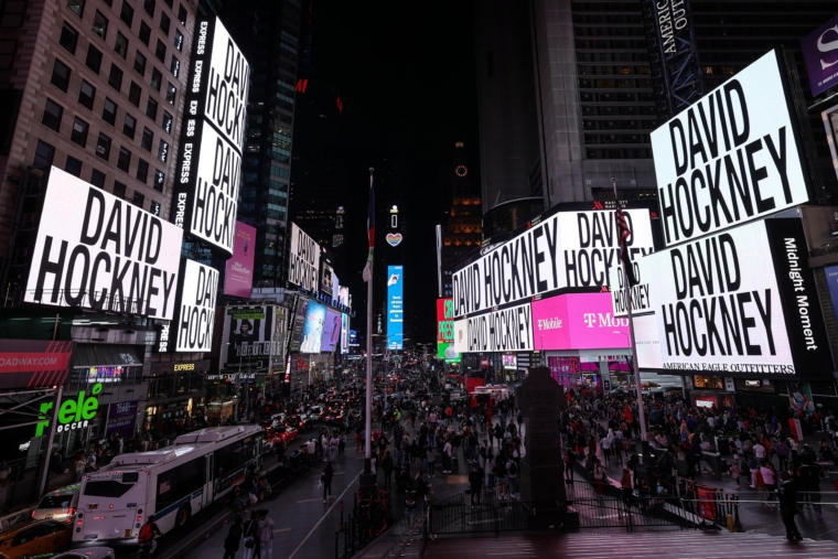 NEW YORK, NEW YORK - MAY 01: A view of electronic billboards introducing animated artwork by British artist David Hockney in Times Square on May 01, 2021 in New York City. The new digital piece, titled "Remember that you cannot look at the sun or death for very long," was unveiled across a network of the world's most iconic outdoor video screens, uniting New York, London, Tokyo, and Seoul throughout May. (Photo by Dia Dipasupil/Getty Images)