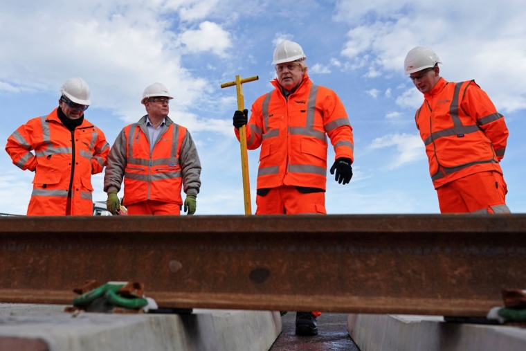 Britain's Prime Minister Boris Johnson visits the Network Rail hub at Gascoigne Wood as the government announces its Integrated Rail plan, in Selby, Britain November 18, 2021. Ian Forsyth/Pool via REUTERS